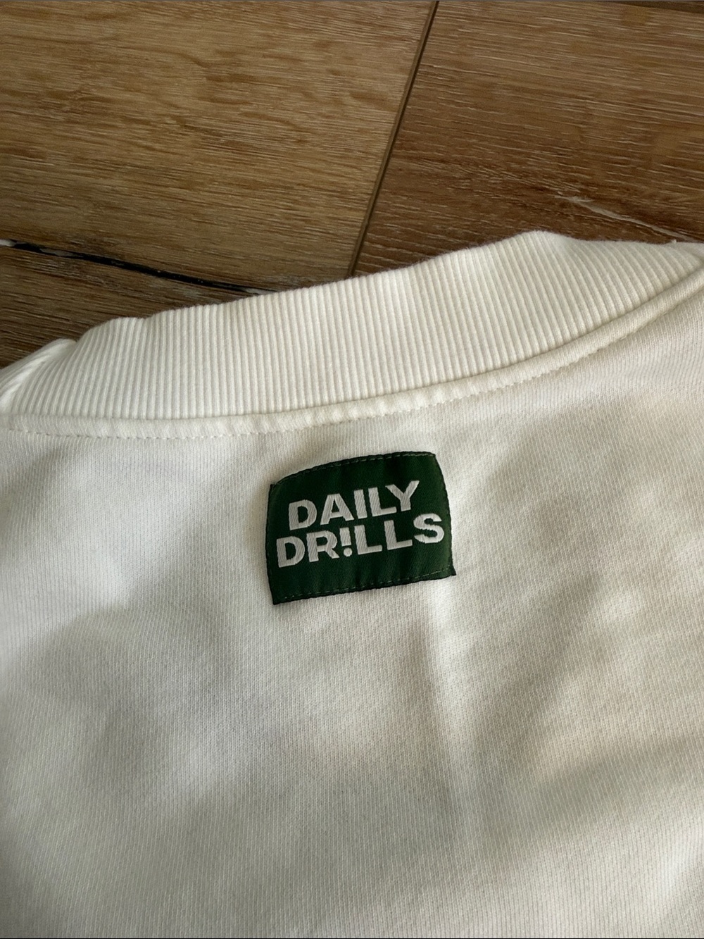 Daily Drills Cream Crewneck with Green Logo Tab